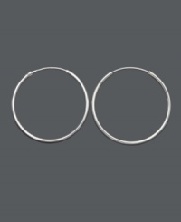 Every girl's go-to earrings are a pair of simple, silver hoops. Earrings feature a medium-sized hoop design crafted in sterling silver. Approximate diameter: 1-1/4 inches. Every girl's go-to earrings are a pair of simple, silver hoops. Earrings feature a medium-sized hoop design crafted in sterling silver. Approximate diameter: 1-1/4 inches.