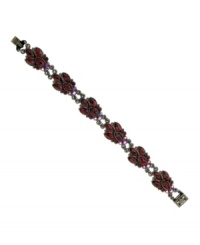 Regal and resplendent. Majestic marquise-cut stones make 2028's Navette bracelet fit for a queen! Set in hematite tone mixed metal, it's embellished with rich red glass accents. Approximate length: 6-1/2 inches. Regal and resplendent. Majestic marquise-cut stones make 2028's Navette bracelet fit for a queen! Set in hematite tone mixed metal, it's embellished with rich red glass accents. Approximate length: 6-1/2 inches.