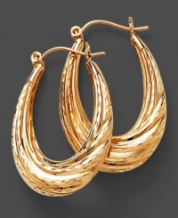 Always the perfect choice, these classic oval hoop earrings are crafted of polished 14k gold in a distinctive textured twist design. Diameter measures 30 mm. Always the perfect choice, these classic oval hoop earrings are crafted of polished 14k gold in a distinctive textured twist design. Diameter measures 30 mm.