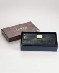 Stow your stash in signature style with this sophisticated silhouette from Lauren Ralph Lauren. Lustrous patent leather is adorned with the iconic LRL monogram print, while the pocket-lined interior keeps you exquisitely organized. Presented in a signature gift box. Stow your stash in signature style with this sophisticated silhouette from Lauren Ralph Lauren. Lustrous patent leather is adorned with the iconic LRL monogram print, while the pocket-lined interior keeps you exquisitely organized. Presented in a signature gift box.