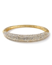 All-around crystals embed a studded, polished bangle from Lauren Ralph Lauren. All-around crystals embed a studded, polished bangle from Lauren Ralph Lauren.