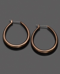 Modernize your look with these Fossil tube hoop earrings crafted in brown ionic-plated mixed metal. Approximate diameter: 1-1/4 inches. Modernize your look with these Fossil tube hoop earrings crafted in brown ionic-plated mixed metal. Approximate diameter: 1-1/4 inches.