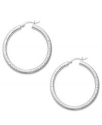 Nothing says classic style like a chic pair of hoop earrings. Studio Silver's style is crafted from thick sterling silver. Approximate diameter: 1-1/2 inches. Nothing says classic style like a chic pair of hoop earrings. Studio Silver's style is crafted from thick sterling silver. Approximate diameter: 1-1/2 inches.