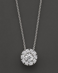 White gold diamond flower cluster pendant. With signature ruby accent. Designed by Roberto Coin. White gold diamond flower cluster pendant. With signature ruby accent. Designed by Roberto Coin.