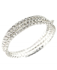 Every girl loves a little glamour. This gorgeous Givenchy bracelet features three rows of round-cut crystal set in silver tone mixed metal. Bracelet stretches to fit wrist. Approximate diameter: 2-1/4 inches. Every girl loves a little glamour. This gorgeous Givenchy bracelet features three rows of round-cut crystal set in silver tone mixed metal. Bracelet stretches to fit wrist. Approximate diameter: 2-1/4 inches.