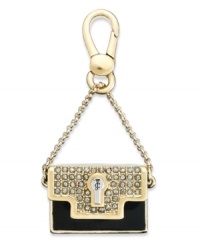 Carry it all with this black and gold charm from Juicy Couture. This limited edition handbag design is embellished with glass pave accents and epoxy detail. Finished with a clasp closure. Crafted in gold tone mixed metal. Approximate drop: 2 inches. Carry it all with this black and gold charm from Juicy Couture. This limited edition handbag design is embellished with glass pave accents and epoxy detail. Finished with a clasp closure. Crafted in gold tone mixed metal. Approximate drop: 2 inches.