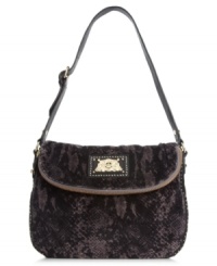 Call of the wild. Tap into the reptilian trend with this snakeskin print purse from Juicy Couture. Soft velour is outfitted with luxe golden hardware and signature detailing, making it the ultimate diva-licious design. Call of the wild. Tap into the reptilian trend with this snakeskin print purse from Juicy Couture. Soft velour is outfitted with luxe golden hardware and signature detailing, making it the ultimate diva-licious design.