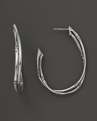 A pair of bamboo hoop earrings from John Hardy make a timeless statement in sterling silver. A pair of bamboo hoop earrings from John Hardy make a timeless statement in sterling silver.