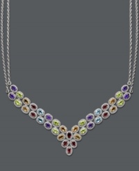 Elevate your look with this fine touch of luxury. This stunning multi-stone v-shaped necklace highlights oval -cut blue topaz (4-1/2 ct. t.w.), peridot (4 ct. t.w.), citrine (3-1/2 ct. t.w.), amethyst (3-1/2 ct. t.w.) and garnet (2-1/2 ct. t.w.). Set in sterling silver. Approximate length: 18 inches. Approximate drop width: 3 inches. Elevate your look with this fine touch of luxury. This stunning multi-stone v-shaped necklace highlights oval -cut blue topaz (4-1/2 ct. t.w.), peridot (4 ct. t.w.), citrine (3-1/2 ct. t.w.), amethyst (3-1/2 ct. t.w.) and garnet (2-1/2 ct. t.w.). Set in sterling silver. Approximate length: 18 inches. Approximate drop width: 3 inches.