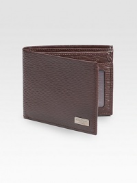 Stamped calfskin wallet with five credit card slots, two currency departments and one ID window. 4½W X 3½H Made in Italy Stamped calfskin wallet with five credit card slots, two currency departments and one ID window. 4½W X 3½H Made in Italy