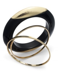 Bold with a splash of shimmer. Bar III's unique three bangle set combines a black resin bangle with a pop of gold detail with two skinny bangles in gold tone mixed metal. Approximate diameter: 2-1/2 inches. Bold with a splash of shimmer. Bar III's unique three bangle set combines a black resin bangle with a pop of gold detail with two skinny bangles in gold tone mixed metal. Approximate diameter: 2-1/2 inches.