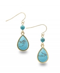 Reconstituted turquoise looks regal and resplendent in these teardrop-shaped earrings from Lauren by Ralph Lauren. Crafted in gold tone mixed metal. Approximate drop: 1-1/2 inches. Reconstituted turquoise looks regal and resplendent in these teardrop-shaped earrings from Lauren by Ralph Lauren. Crafted in gold tone mixed metal. Approximate drop: 1-1/2 inches.