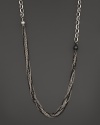 A gorgeous jumble of dark and white sterling silver chains. By Gurhan.