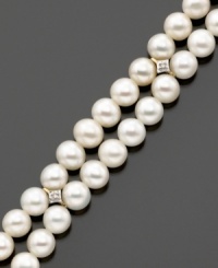 Always classic, the pearl bracelet is the perfect choice for special occasions. Luminous white cultured freshwater pearls measuring 5x5.5mm accented with dazzling diamonds set in 14k gold. Length measures 7 inches. Always classic, the pearl bracelet is the perfect choice for special occasions. Luminous white cultured freshwater pearls measuring 5x5.5mm accented with dazzling diamonds set in 14k gold. Length measures 7 inches.