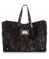 Give your look an exotic edge with this sleek snakeskin-print tote from Juicy Couture. Soft velour is outfitted with luxe golden hardware and signature detailing, making it the ultimate diva-worthy design.