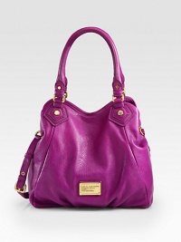Rich pebble-grain leather forms this slouchy tote with a versatile strap and signature metal plaque. Adjustable detachable shoulder strap, 17-18½ dropDouble top handles, 5 dropMagnetic snap closureOne inside zip pocketTwo inside open pocketsFully lined11½W X 12H X 4DImported Rich pebble-grain leather forms this slouchy tote with a versatile strap and signature metal plaque. Adjustable detachable shoulder strap, 17-18½ dropDouble top handles, 5 dropMagnetic snap closureOne inside zip pocketTwo inside open pocketsFully lined11½W X 12H X 4DImported
