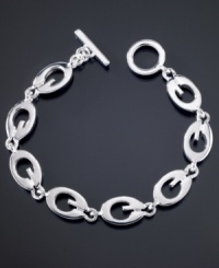 Totally trendy, this GUESS logo link bracelet goes with all of your looks. Featuring G logo links crafted in silvertone mixed metal. Approximate length: 7-1/2 inches. Totally trendy, this GUESS logo link bracelet goes with all of your looks. Featuring G logo links crafted in silvertone mixed metal. Approximate length: 7-1/2 inches.