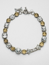 A modern mix of faceted rhinestones and conical, metal studs set in a linked design. Glass stonesOxidized zinc and brassLength, about 16.9Toggle closureImported A modern mix of faceted rhinestones and conical, metal studs set in a linked design. Glass stonesOxidized zinc and brassLength, about 16.9Toggle closureImported