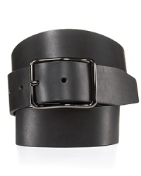 A dapper leather belt features an elongated buckle with a slight wave, bringing modern flair to this refined design. A dapper leather belt features an elongated buckle with a slight wave, bringing modern flair to this refined design.