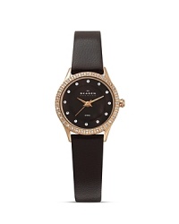 This Skagen watch is styled for maximum simplicity with a hint of sparkle, crafted of stainless steel with a sleek leather band as the compliment. This Skagen watch is styled for maximum simplicity with a hint of sparkle, crafted of stainless steel with a sleek leather band as the compliment.