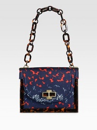 A colorful printed canvas style with glossy resin accents and radiant hardware.Resin chain link shoulder strap, 10 dropMagnetic snap flap closureOne inside zip pocketCotton lining8½W X 6¼H X 3DImported A colorful printed canvas style with glossy resin accents and radiant hardware.Resin chain link shoulder strap, 10 dropMagnetic snap flap closureOne inside zip pocketCotton lining8½W X 6¼H X 3DImported