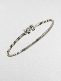 A charming, sterling silver cable design with a pretty diamond accented bow. Sterling silverDiamonds, .02 tcwDiameter, about 2½Slip-on styleImported 