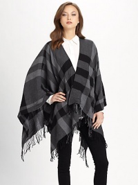 A check design with a fringe trim. Open front Extra fine wool About 26 from should to hem Dry clean Imported A check design with a fringe trim. Open front Extra fine wool About 26 from should to hem Dry clean Imported