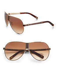 THE LOOKNavigator style Metal framesLogo etched lens Logo temples Lizard-embossed bridge and temples Signature case includedTHE COLORGoldtone with brown gradient lensesORIGINMade in Italy THE LOOKNavigator style Metal framesLogo etched lens Logo temples Lizard-embossed bridge and temples Signature case includedTHE COLORGoldtone with brown gradient lensesORIGINMade in Italy