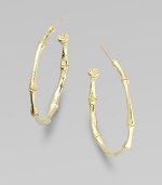 A bamboo hoop in 18K yellow gold for a subtle twist to classic design.18K gold Diameter, about 1 Post backs Made in USA 
