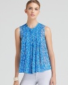 Pretty pleats add ladylike charm to this breezy DIANE von FURSTENBERG top in pure silk.