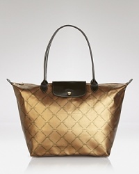 The epitome of laid back luxe. Longchamp's signature shoulder bag is a shining example of have-now and wear-forever style, crafted of coated cotton with leather trim. The epitome of laid back luxe. Longchamp's signature shoulder bag is a shining example of have-now and wear-forever style, crafted of coated cotton with leather trim.