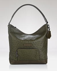 Simple, elegant, and serpentine, an exotic Longchamp handbag makes an impact styled in embossed leather. Its top zip closure opens to a lined interior with 3 zip pockets. Simple, elegant, and serpentine, an exotic Longchamp handbag makes an impact styled in embossed leather. Its top zip closure opens to a lined interior with 3 zip pockets.