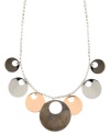 Out of this world. Striking cut-out circles create a unique orbital design on Nine West's shaky necklace. Set in silver, rose gold, and hematite-plated mixed metal. Approximate length: 17 inches + 2-inch extender. Approximate drop: 1-1/2 inches.