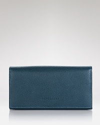 A well-made, understated luxury from Longchamp keeps your essentials organized, secured by a snap closure that opens to an interior with 10 credit card slots. A well-made, understated luxury from Longchamp keeps your essentials organized, secured by a snap closure that opens to an interior with 10 credit card slots.