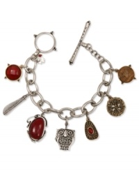 The charmed life. Lucky Brand offers this charm bracelet crafted from silver and gold tone mixed metal featuring a finely detailed owl surrounded by picture jasper and semi-precious calcite and carnelian accents. Approximate length: 7-3/4 inches. The charmed life. Lucky Brand offers this charm bracelet crafted from silver and gold tone mixed metal featuring a finely detailed owl surrounded by picture jasper and semi-precious calcite and carnelian accents. Approximate length: 7-3/4 inches.