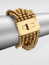 From the Modern Classics Collection. Bold and beautiful strands of polished beads with a glowing golden finish are connected to a striking turn-lock clasp in this sophisticated design.GoldtoneLength, about 7Width, about 1.75Turn-lock claspImported From the Modern Classics Collection. Bold and beautiful strands of polished beads with a glowing golden finish are connected to a striking turn-lock clasp in this sophisticated design.GoldtoneLength, about 7Width, about 1.75Turn-lock claspImported