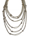 Change your tone with doubled-up fashion. This BCBGeneration necklace features several rows of woven chains accented by knotted detail. Crafted in silver tone and gold tone mixed metal. Approximate length: 19 inches.