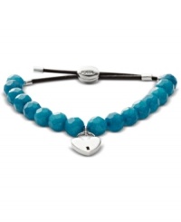 Fossil's beaded bracelet features a chocolate leather cord decorated with faceted and dyed jade beads. Includes a silver tone heart lock charm. Stretches to fit wrist. Approximate diameter: 2-1/4 inches. Fossil's beaded bracelet features a chocolate leather cord decorated with faceted and dyed jade beads. Includes a silver tone heart lock charm. Stretches to fit wrist. Approximate diameter: 2-1/4 inches.