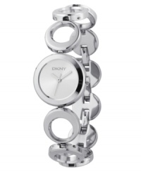 Simple geometry never looked so divine than in this elegant women's watch from DKNY. Featuring a silvertone stainless steel bracelet with snap-off adjustable links. Round stainless steel case. White round dial with logo. Quartz movement. Water resistant to 30 meters. Two-year limited warranty.