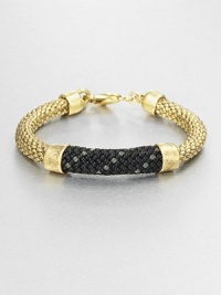 A striking piece with a metallic, braided rope with contrast rope accents. RopeBrass-plated metalLength, about 7.5Hook closureMade in USA A striking piece with a metallic, braided rope with contrast rope accents. RopeBrass-plated metalLength, about 7.5Hook closureMade in USA