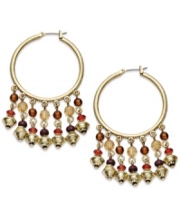 Colorful beads fashioned from glass, resin and wood create head-turning style on these Lauren Ralph Lauren hoop earrings. Set in 14k gold-plated mixed metal. Approximate drop: 2-1/4 inches. Colorful beads fashioned from glass, resin and wood create head-turning style on these Lauren Ralph Lauren hoop earrings. Set in 14k gold-plated mixed metal. Approximate drop: 2-1/4 inches.