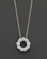 A lovely diamond circle pendant necklace in diamond and 14 Kt. white gold. A lovely diamond circle pendant necklace in diamond and 14 Kt. white gold.