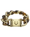 Kick it into neutral with this chic link bracelet from Michael Kors! Crafted in gold tone brass and tortoise acetate, features a large lock closure. Approximate length: 8 inches.