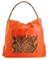A casual nylon silhouette accented with a bold snakeskin print. This go-anywhere hobo will add a fiercely fun feel to any outfit. Bonus: this style is reversible!