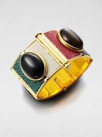 Add a touch of the exotic with this distinctive stingray leather covered wide cuff with stones.Stingray leatherOnyx and tiger's eyeGoldtoneLength, about 2¼Width, about 2Push-lock closureMade in Italy Add a touch of the exotic with this distinctive stingray leather covered wide cuff with stones.Stingray leatherOnyx and tiger's eyeGoldtoneLength, about 2¼Width, about 2Push-lock closureMade in Italy