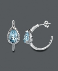 A traditional hoop earring with an extra touch of shine. Victoria Townsend's elegant design highlights a pear-cut blue topaz (4 ct. t.w.) surrounded by sparkling diamond accents. Crafted in sterling silver. Approximate diameter: 7/8 inch. A traditional hoop earring with an extra touch of shine. Victoria Townsend's elegant design highlights a pear-cut blue topaz (4 ct. t.w.) surrounded by sparkling diamond accents. Crafted in sterling silver. Approximate diameter: 7/8 inch.