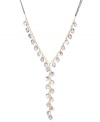 Long and luxurious. Kenneth Cole New York's subtly shimmering y-shaped necklace features faceted glass beads and crystal-encrusted discs in hematite hues. Chain crafted from gold tone mixed metal. Approximate length: 27 inches + 3-inch extender. Approximate drop: 7-1/2 inches.