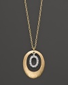 A circle of 14K. yellow gold frames a ring of diamonds. By Meira T.