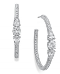 Classic hoops with glistening glam. Eliot Danori's large hoop earrings feature pave-cut crystal accents and cubic zirconia (2-1/5 ct. t.w.) crafted from rhodium-plated tone mixed metal. Approximate diameter: 1-1/4 inch. Classic hoops with glistening glam. Eliot Danori's large hoop earrings feature pave-cut crystal accents and cubic zirconia (2-1/5 ct. t.w.) crafted from rhodium-plated tone mixed metal. Approximate diameter: 1-1/4 inch.