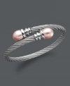 Wrap your wrists in polished perfection. This coil-shaped bangle bracelet features pink cultured freshwater pearls (10-11 mm) set in stainless steel. Approximate length: 8 inches.